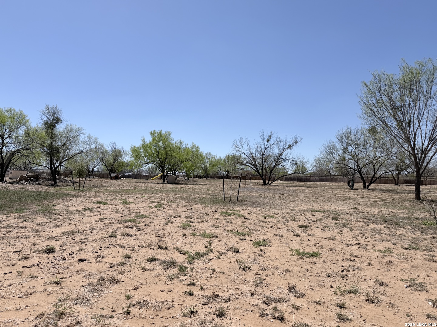 152 County Roads 2667 Devine, TX 78016 - Photo 49 of 51 a view of a yard with trees in the background