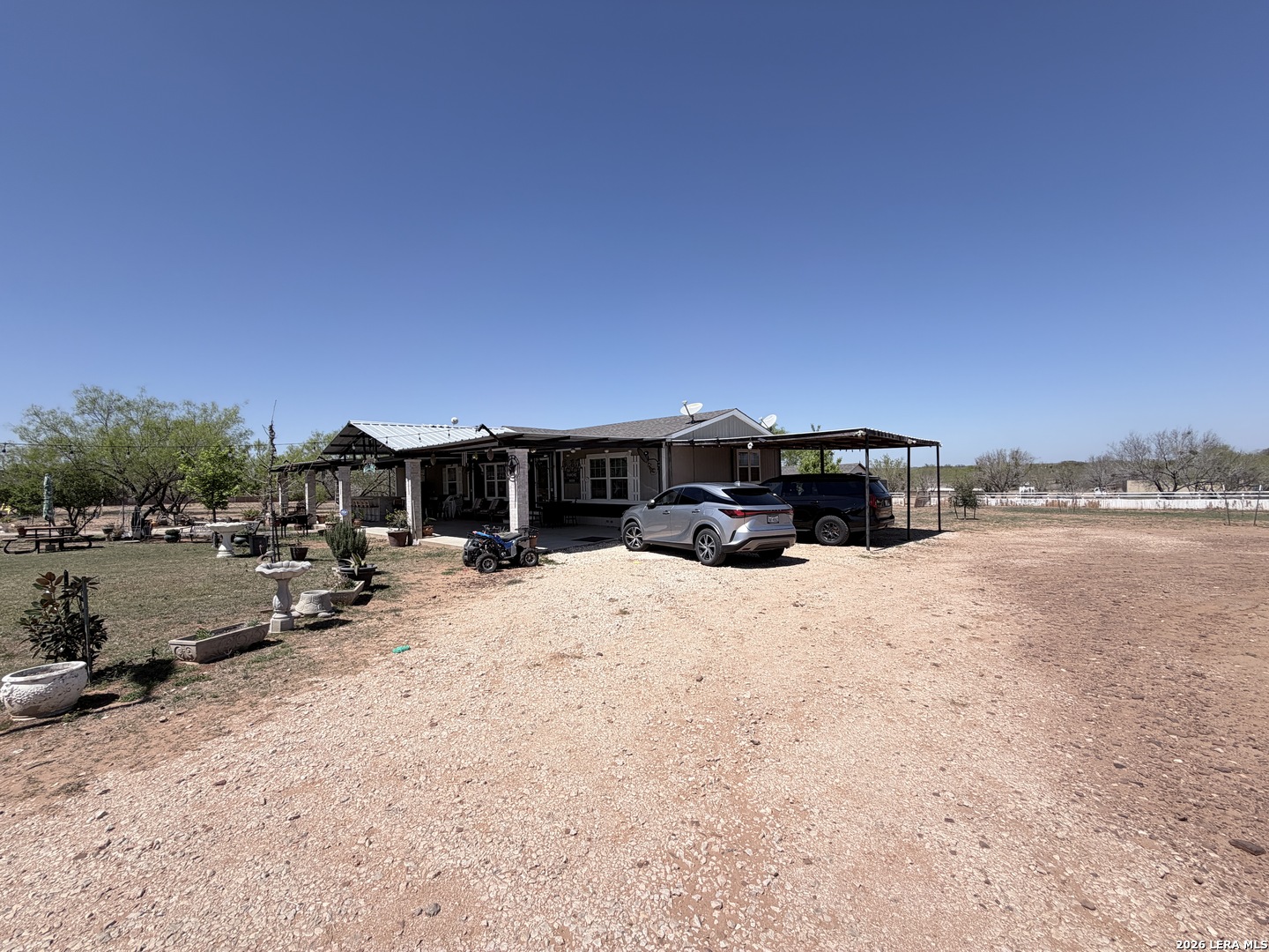 152 County Roads 2667 Devine, TX 78016 - Photo 5 of 51 a view of a lake with a car parked in front of it