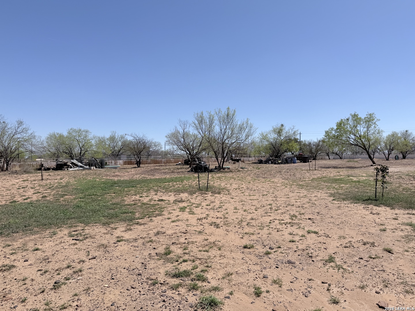 152 County Roads 2667 Devine, TX 78016 - Photo 51 of 51 a view of a dry yard with wooden fence