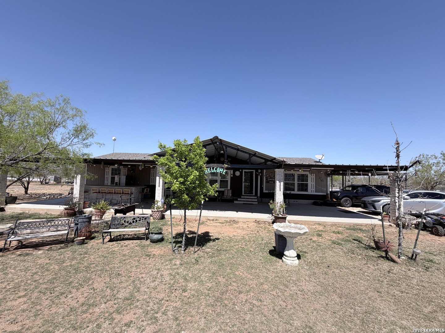 152 County Roads 2667 Devine, TX 78016 - Photo 7 of 51 a view of a backyard with a patio
