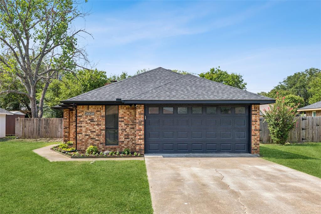 2609 Boulder Drive Corinth, TX 76210 - Photo 1 of 1 a front view of a house with a yard