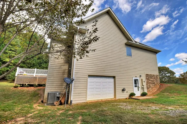 a front view of a house with a garden and yard