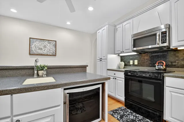 a view of a dining room with furniture large windows and wooden floor