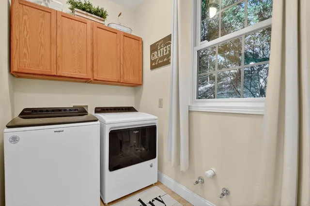 a spacious bedroom with a bed and a large window
