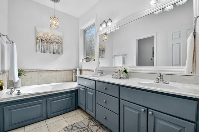 a view of empty room with wooden floor and furniture