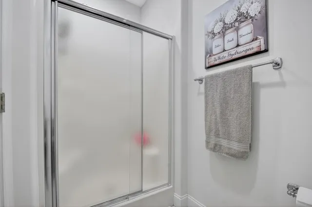 a view of a dining room with furniture and window