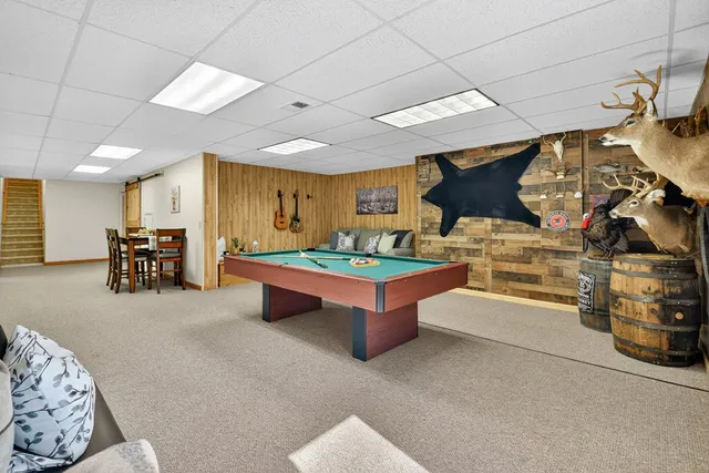 a kitchen with stainless steel appliances granite countertop a sink a stove and cabinets