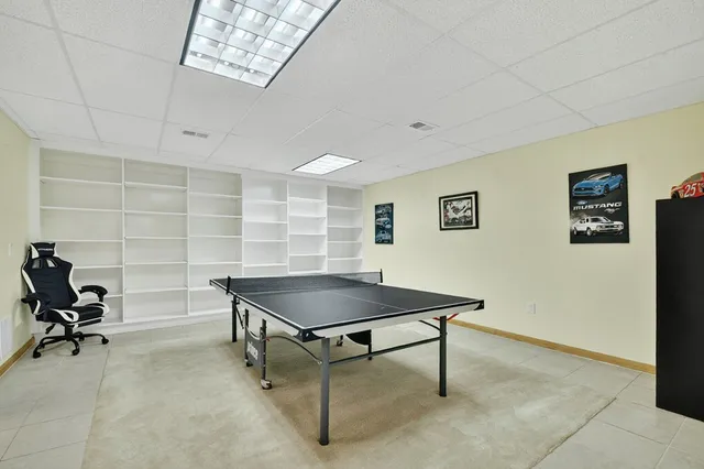 a bedroom with a bed and a mirror