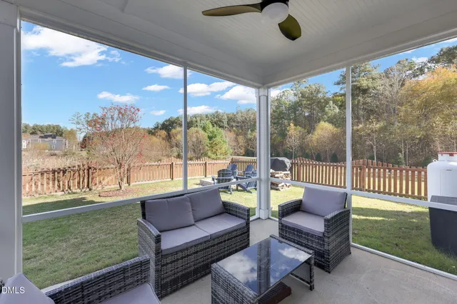 a view of a house with a yard and porch