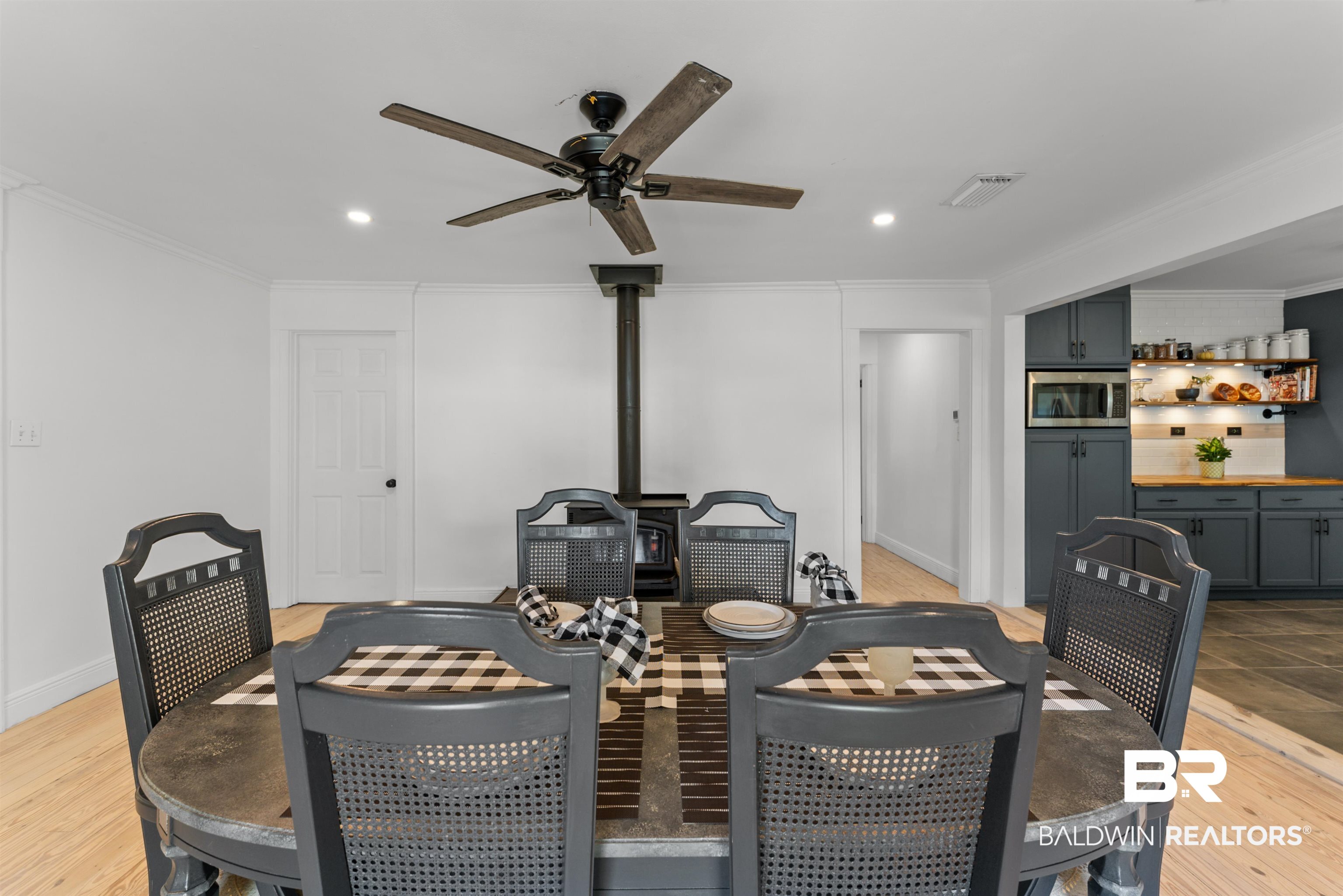 6447 Bemis Lane Bon Secour, AL 36511 - Photo 24 of 62 Spacious dining area featuring light wood-finish flooring and a ceiling fan