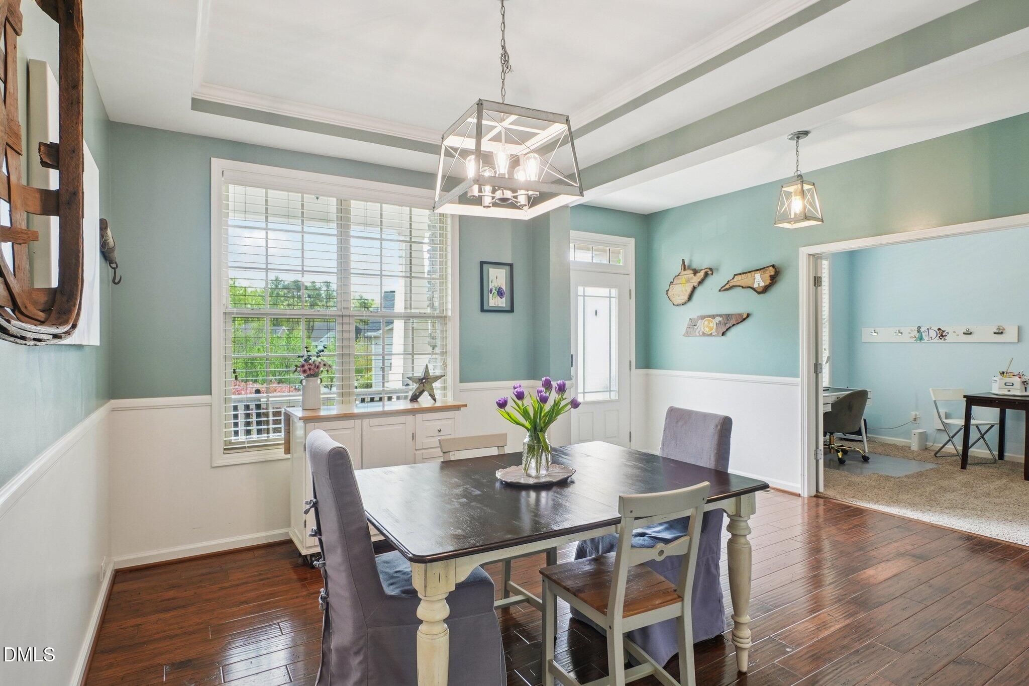 203 Hico Way Durham, NC 27703 - Photo 20 of 62 a view of a dining room with furniture window and wooden floor