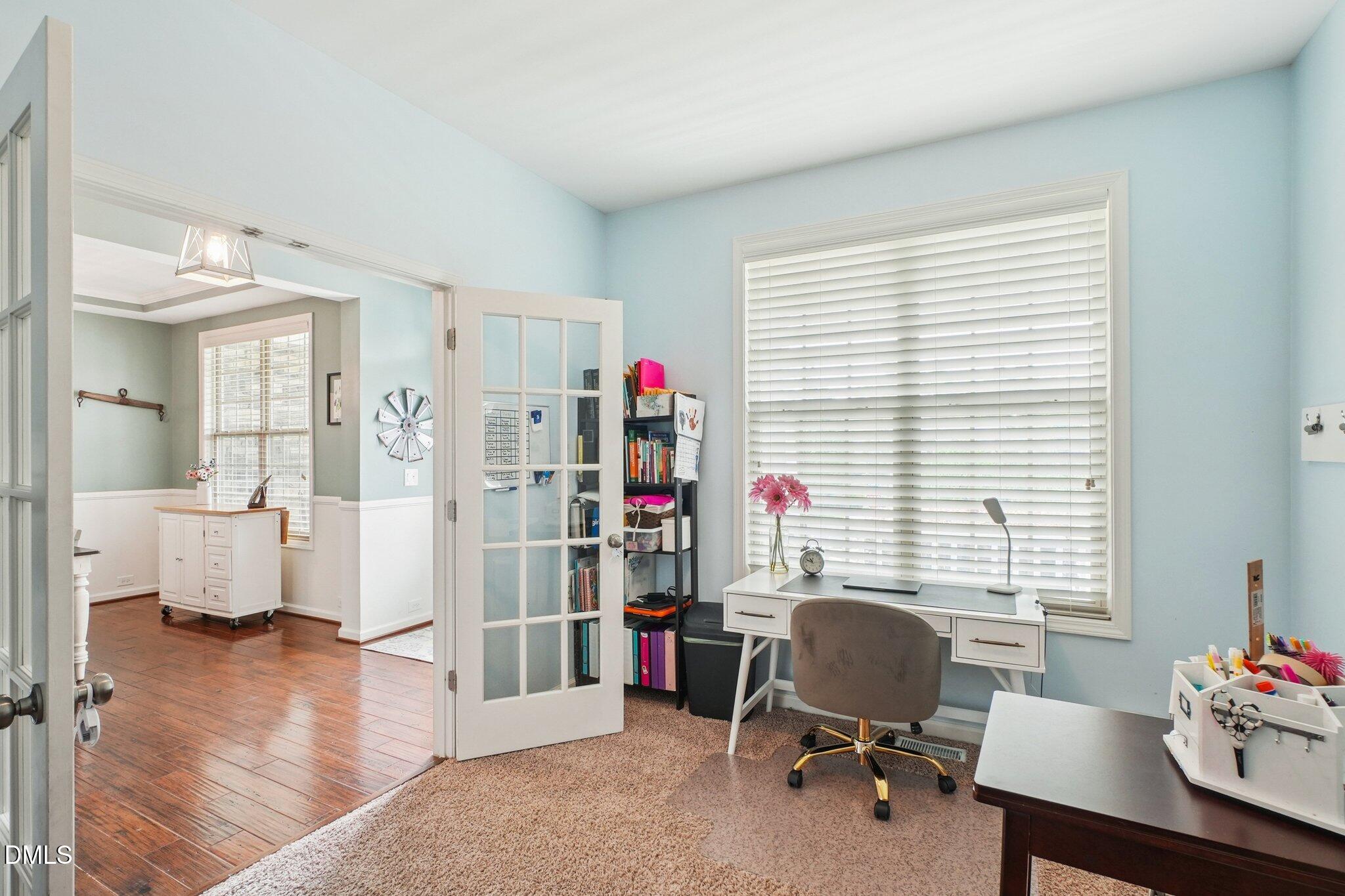 203 Hico Way Durham, NC 27703 - Photo 22 of 62 a view of a livingroom with workspace and a window