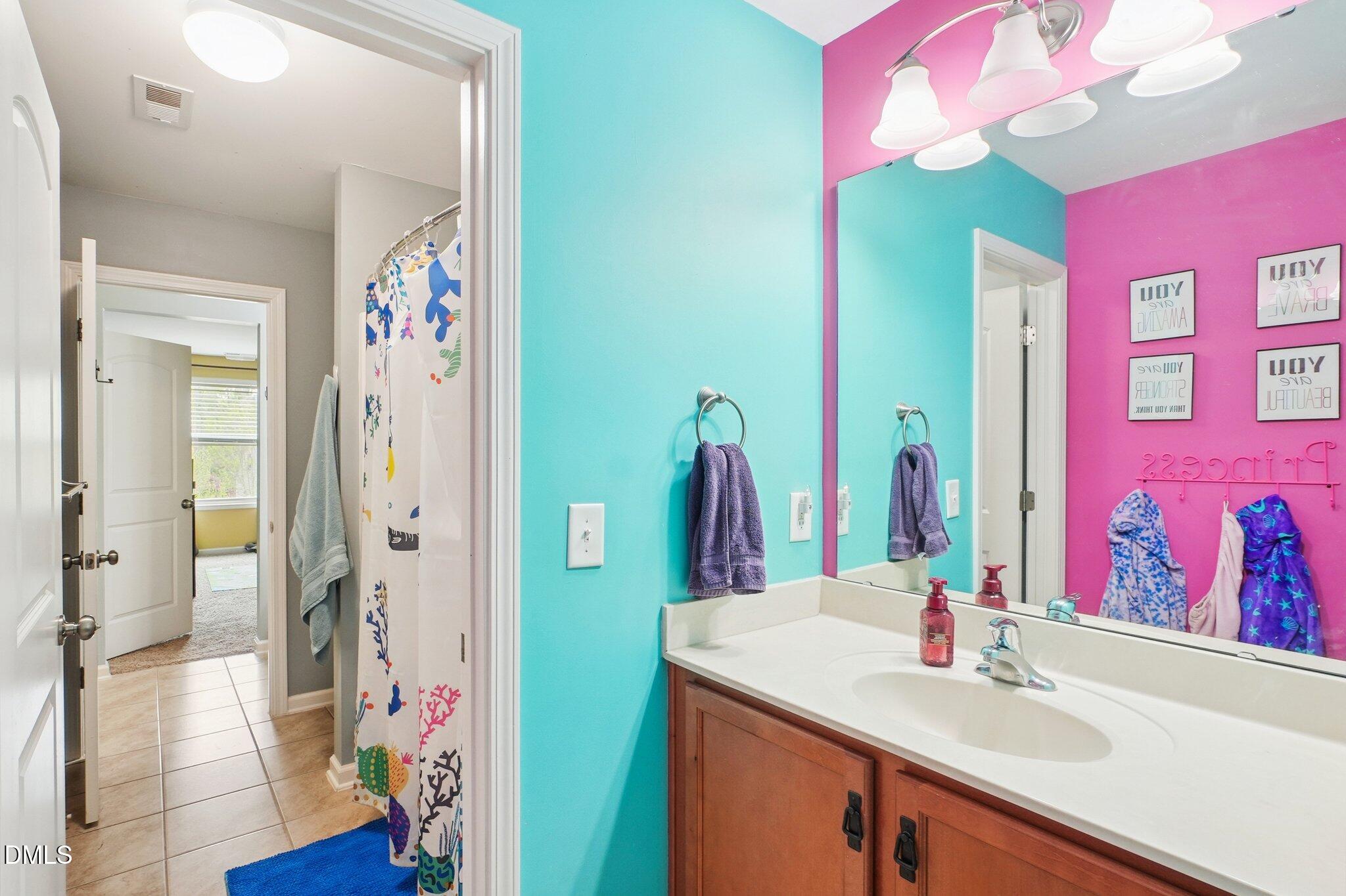 203 Hico Way Durham, NC 27703 - Photo 32 of 62 a bathroom with a sink vanity and a mirror