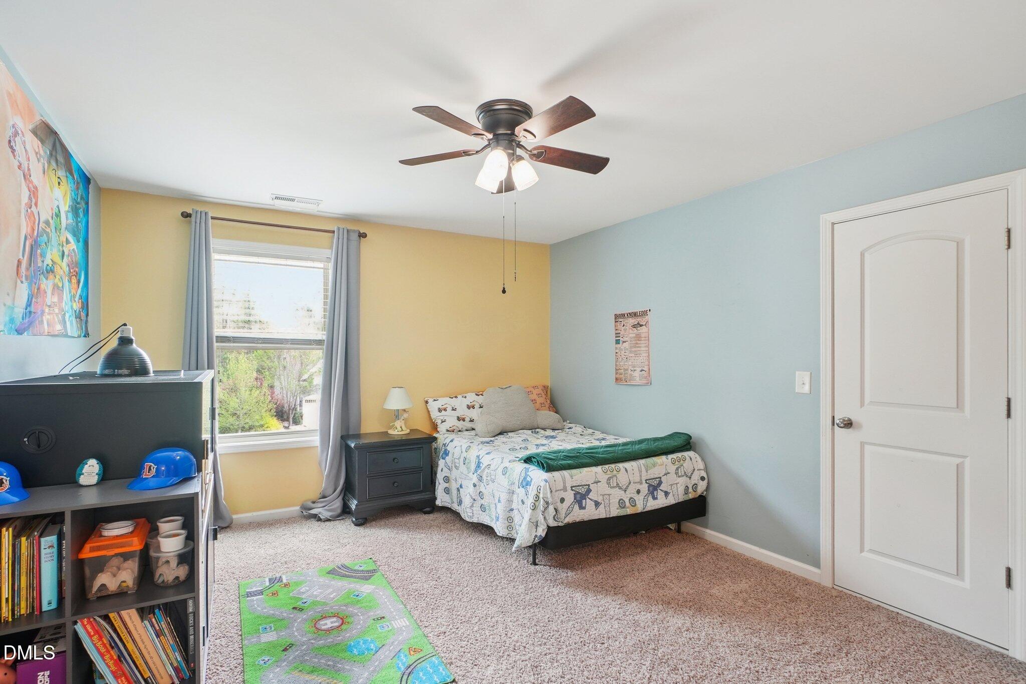203 Hico Way Durham, NC 27703 - Photo 34 of 62 a bedroom with a bed and a window