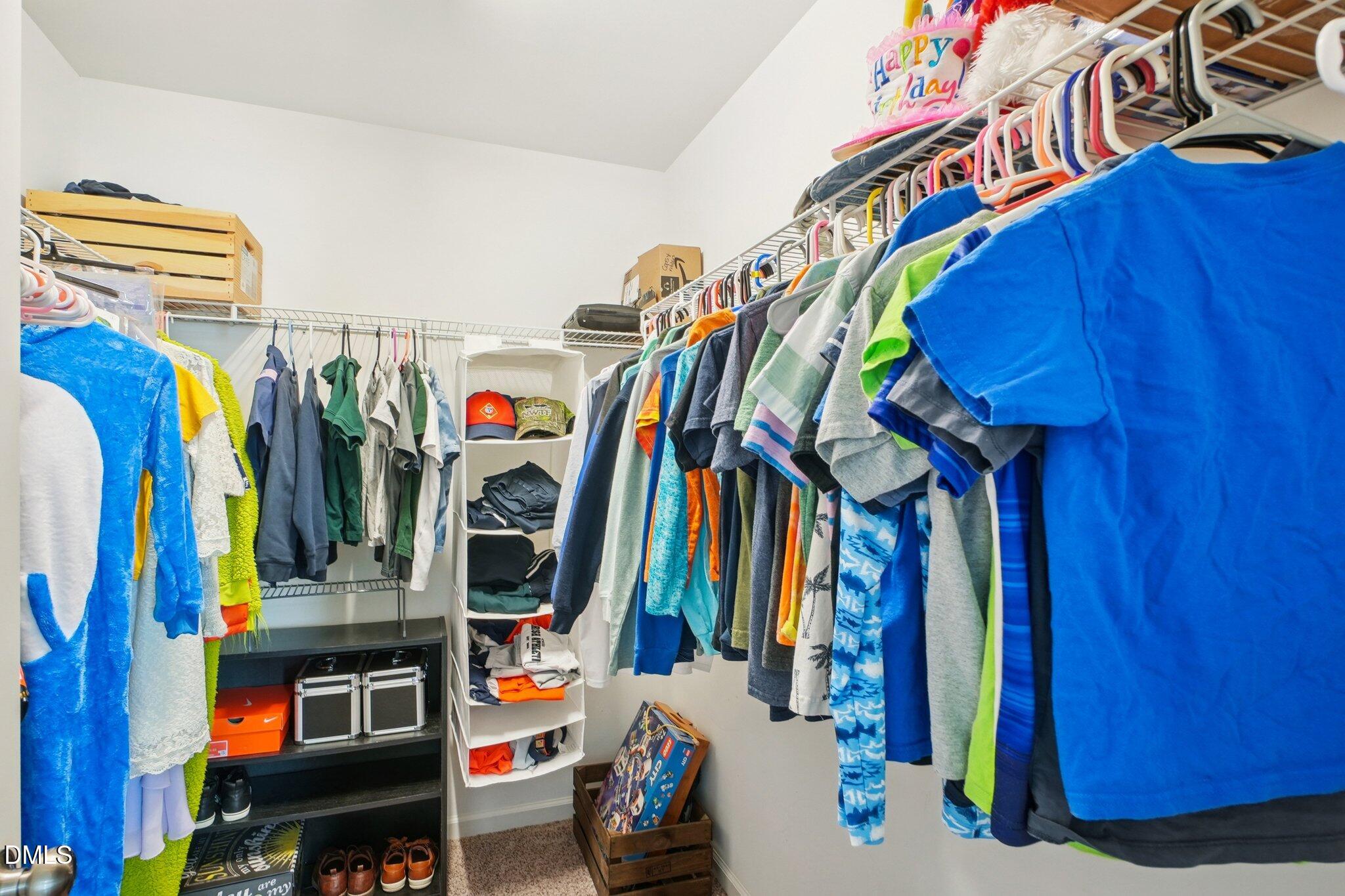 203 Hico Way Durham, NC 27703 - Photo 35 of 62 a view of walk in closet with clothes and shoes