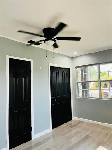 a view of an empty room with a closet