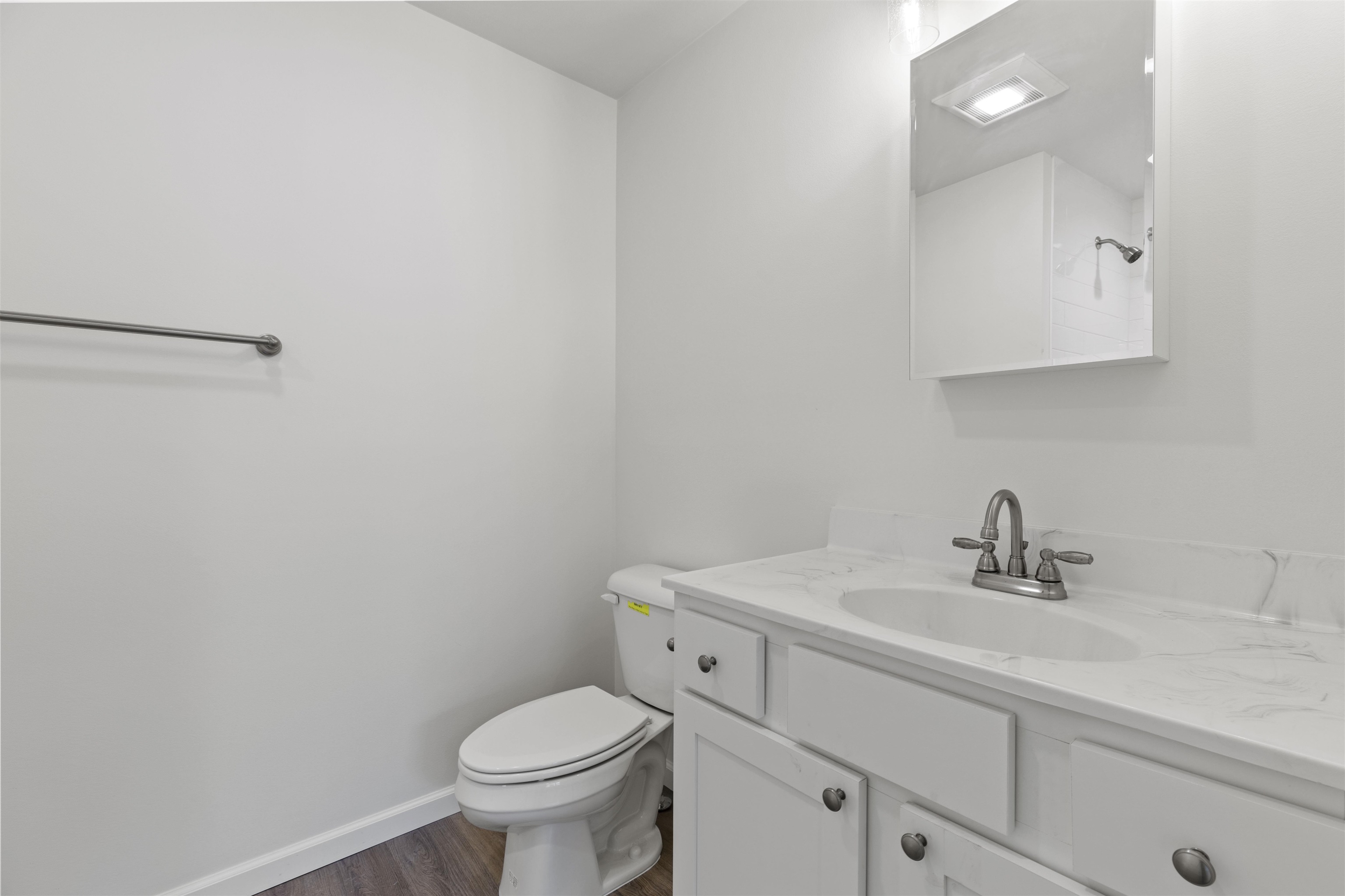 108 Sunray Road Del Haven, NJ 08251 - Photo 14 of 36 a bathroom with a sink toilet and a mirror
