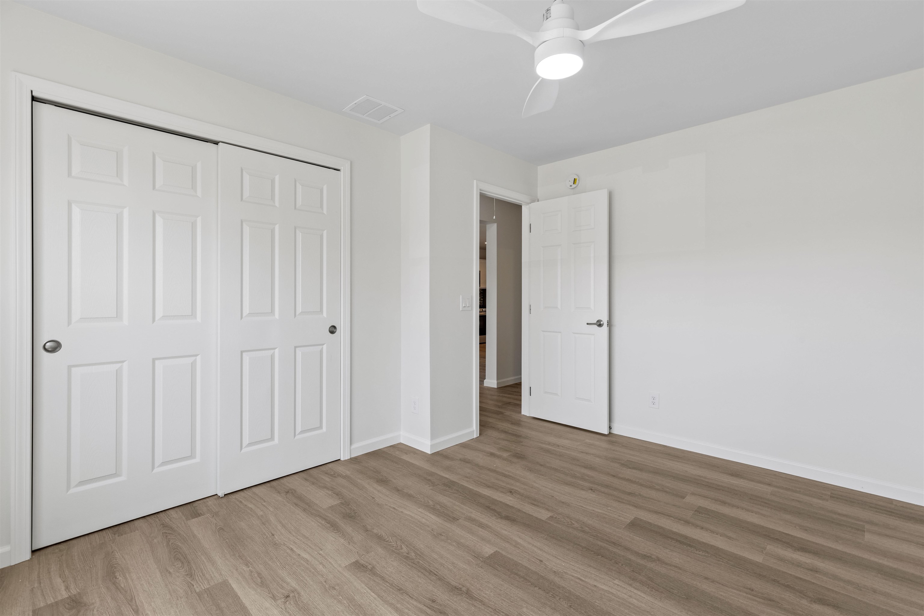108 Sunray Road Del Haven, NJ 08251 - Photo 18 of 36 a view of an empty room with wooden floor