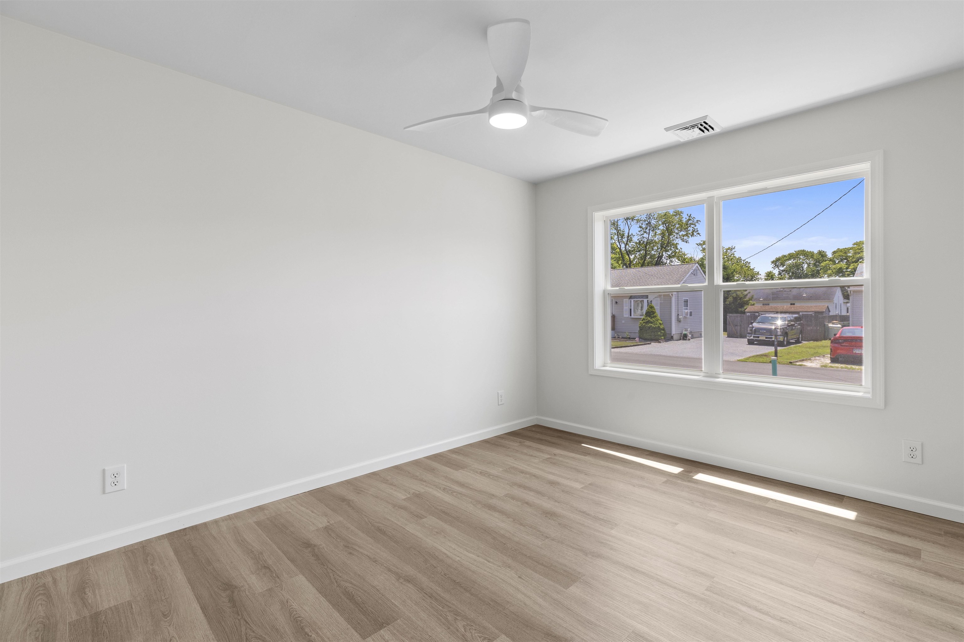 108 Sunray Road Del Haven, NJ 08251 - Photo 22 of 36 wooden floor in an empty room with a window