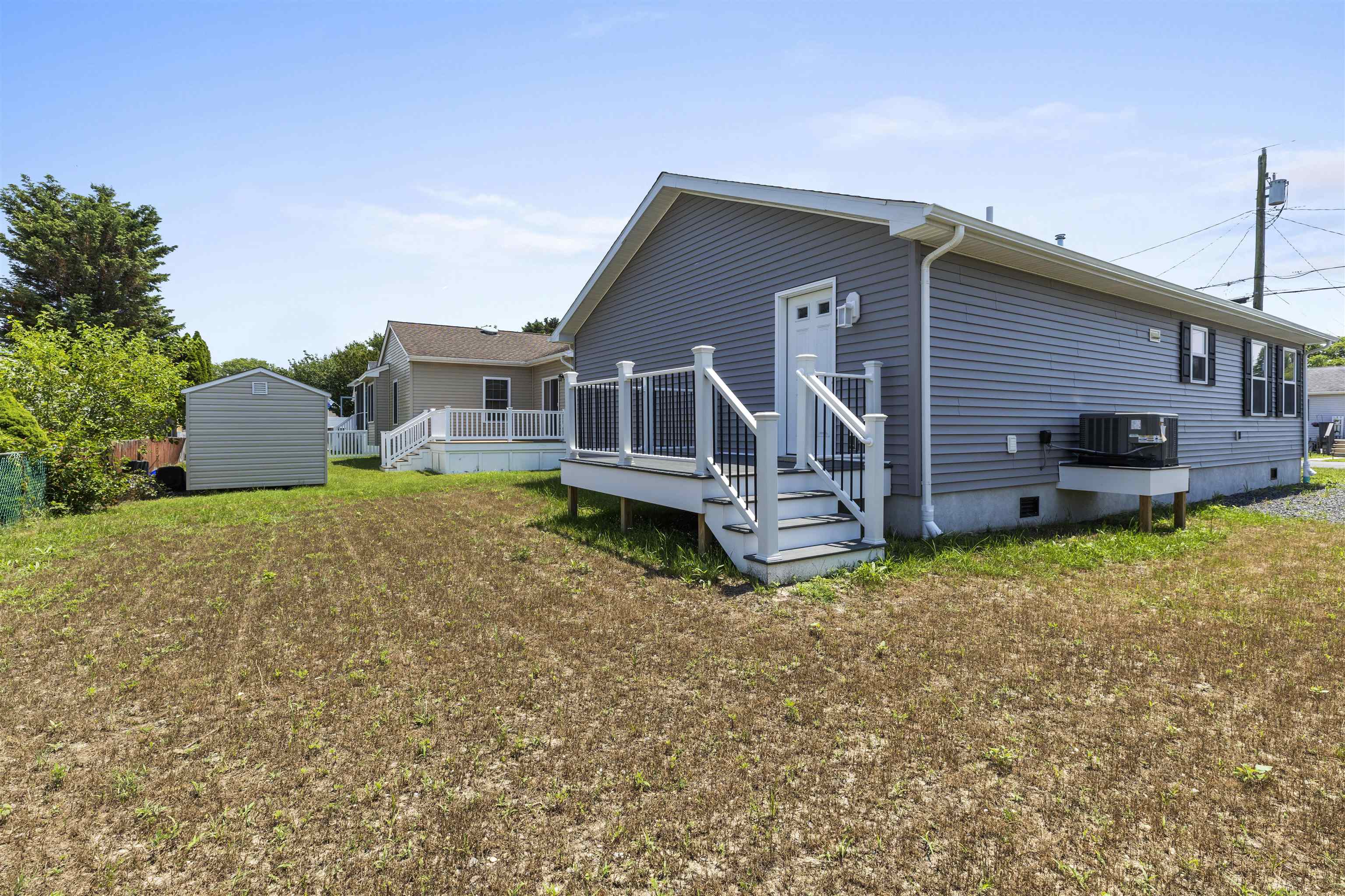 108 Sunray Road Del Haven, NJ 08251 - Photo 26 of 36 front view of a house with a yard