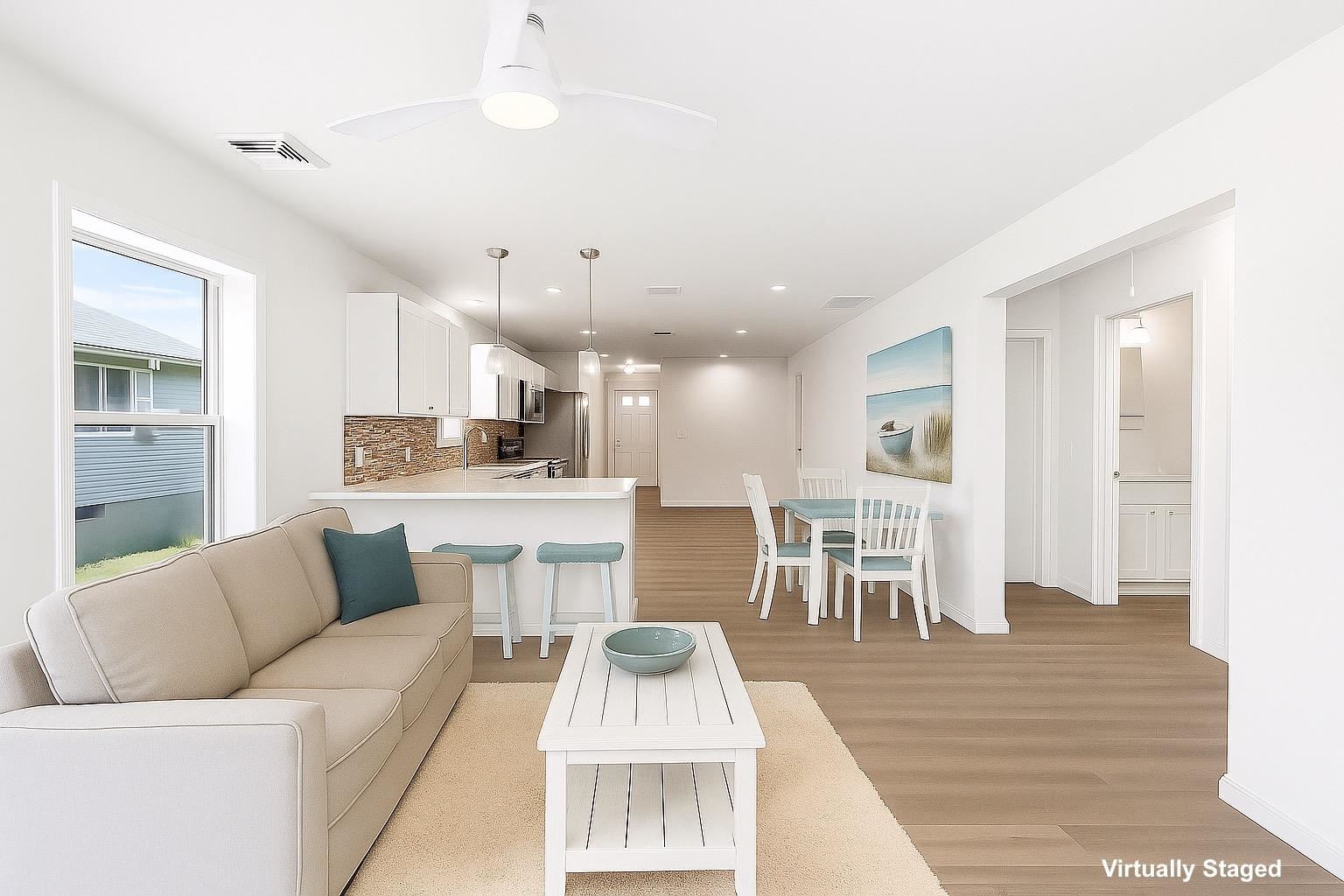 108 Sunray Road Del Haven, NJ 08251 - Photo 3 of 36 a living room with furniture and a dining table with kitchen view