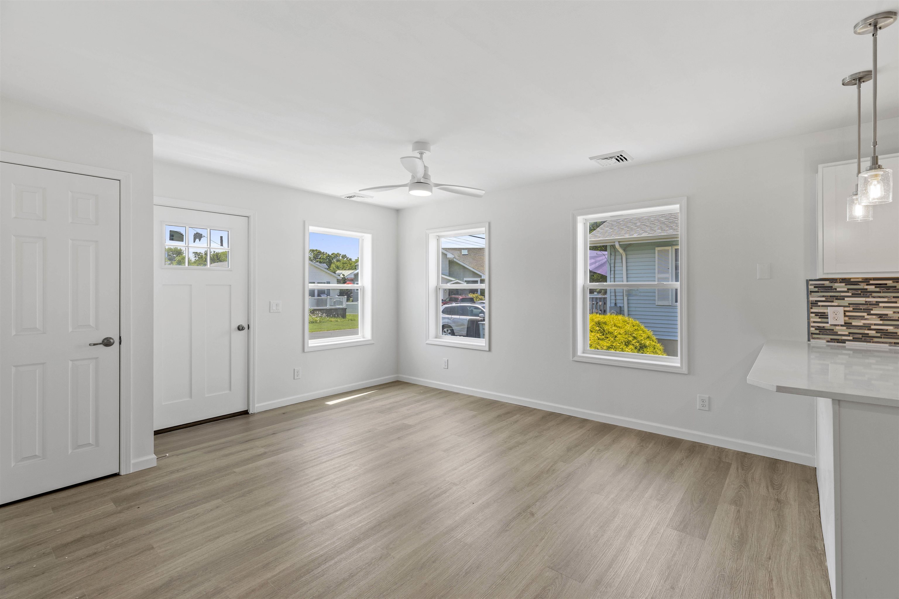 108 Sunray Road Del Haven, NJ 08251 - Photo 4 of 36 a view of an empty room with a window and wooden floor