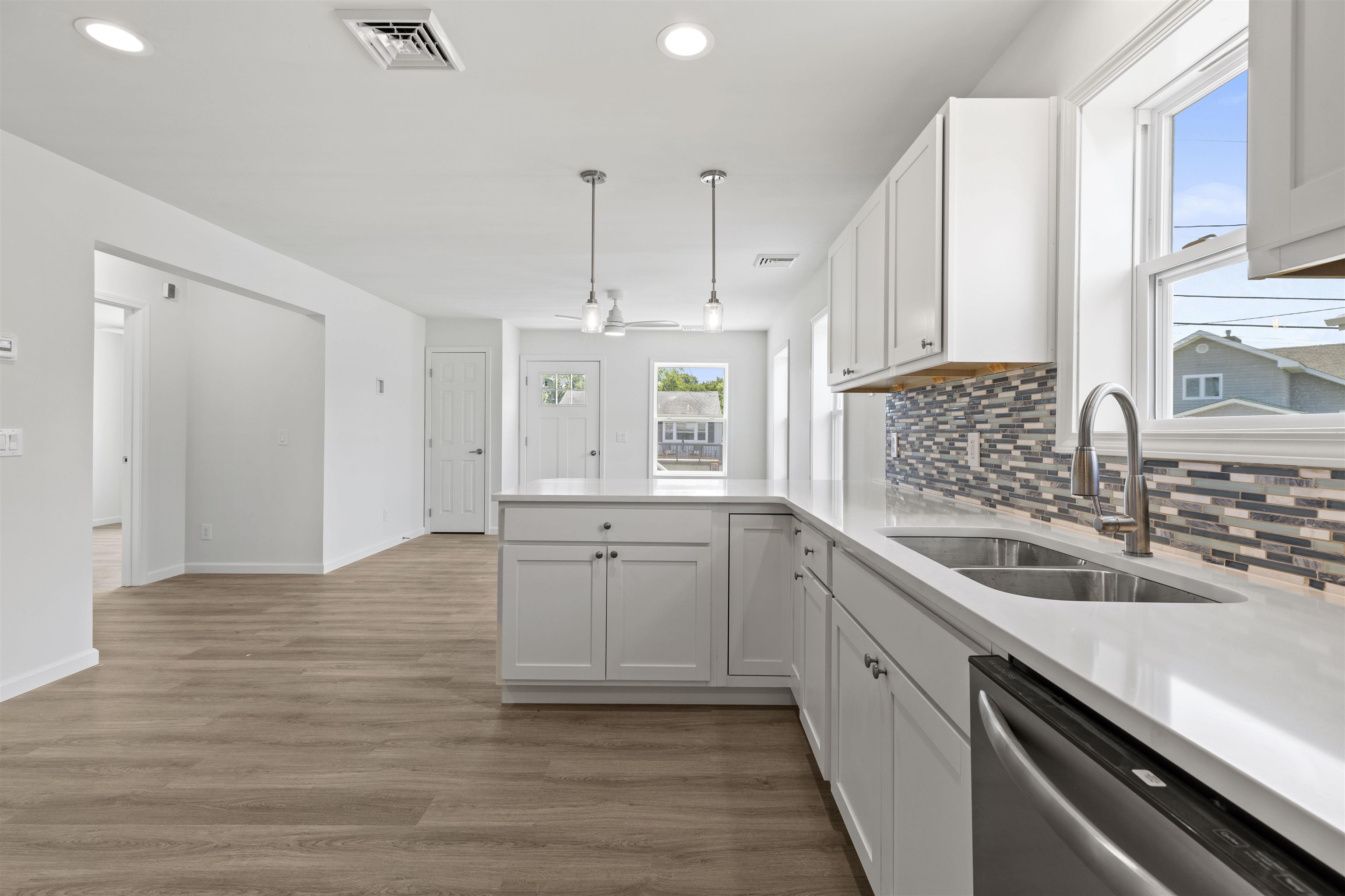 108 Sunray Road Del Haven, NJ 08251 - Photo 7 of 36 a kitchen with a sink stove and cabinets