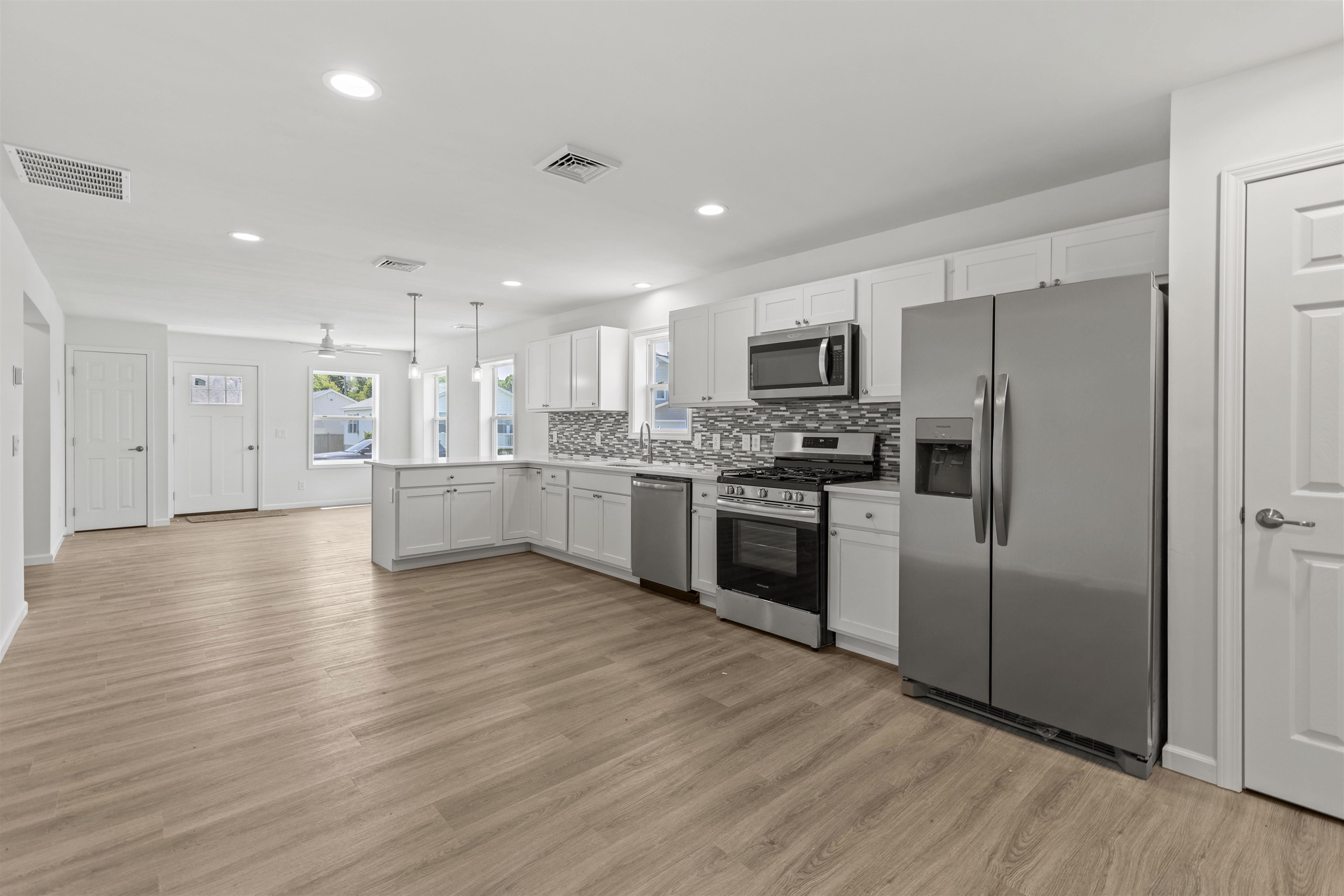 108 Sunray Road Del Haven, NJ 08251 - Photo 8 of 36 a kitchen with a refrigerator and a stove top oven
