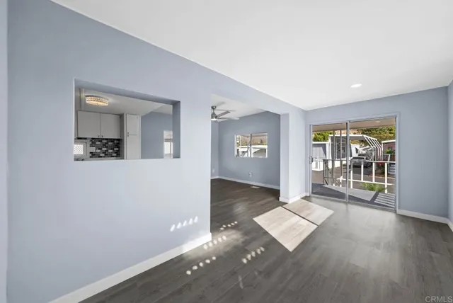 wooden floor with a window in a room