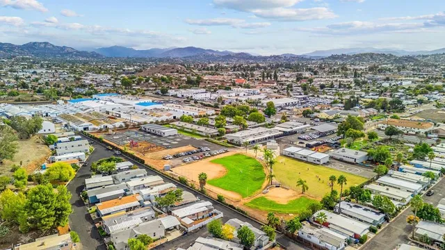 an aerial view of residential houses and outdoor space