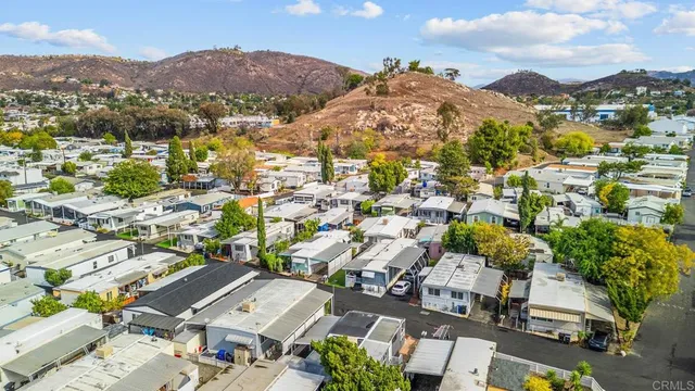 an aerial view of residential houses with outdoor space