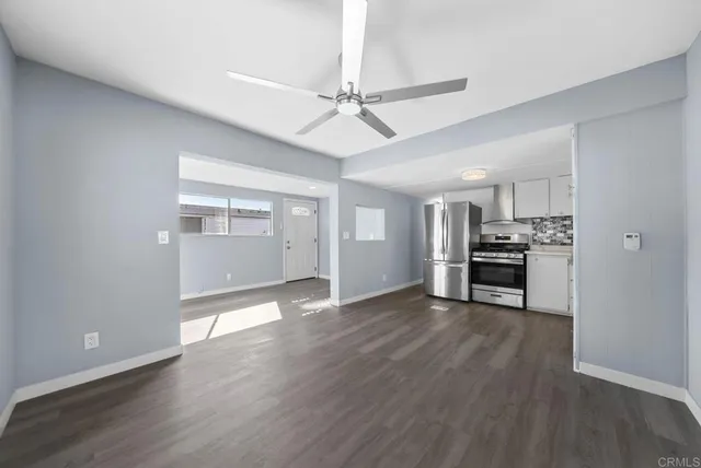 a view of kitchen with furniture and wooden floor