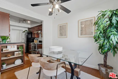 a view of a livingroom with furniture and a potted plant