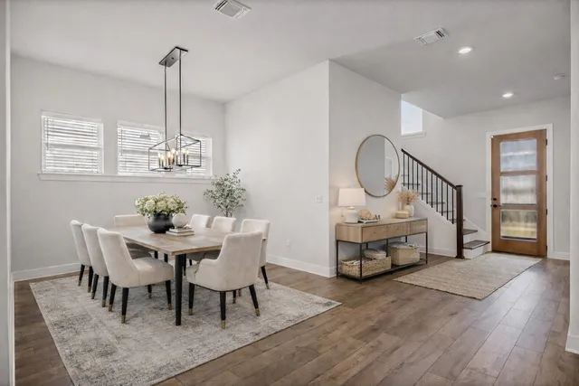 a view of a dining room with furniture window and wooden floor