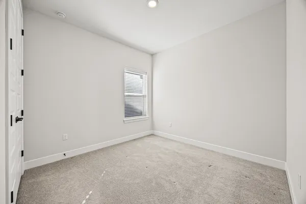 an empty room with a empty space and window