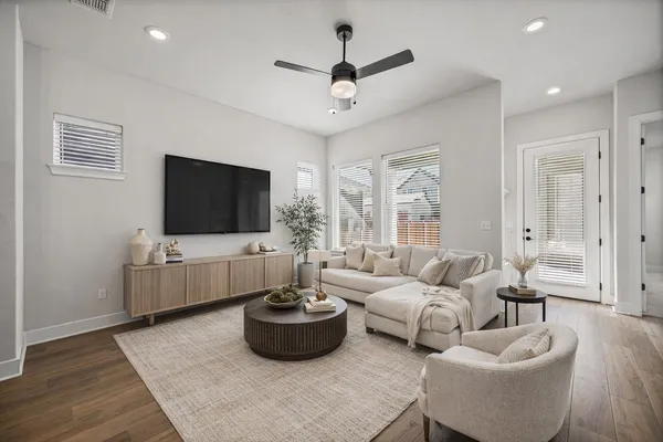 a living room with furniture and a flat screen tv