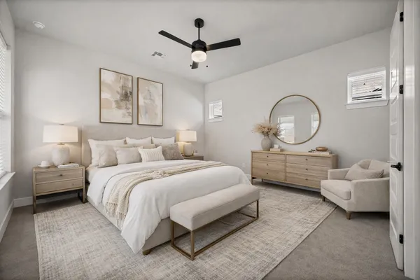 a bed room with a bed mirror and a window