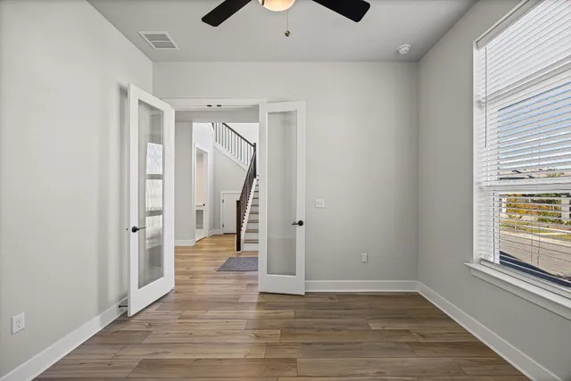 a view of an entryway door with wooden floor