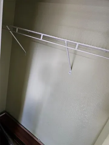 a view of a room with racks on the wall