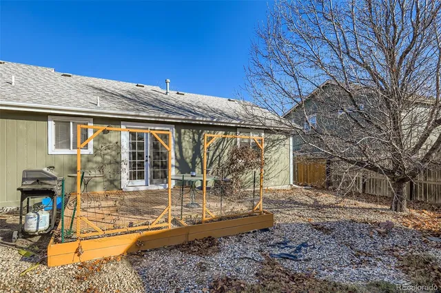 a view of a backyard with large tree
