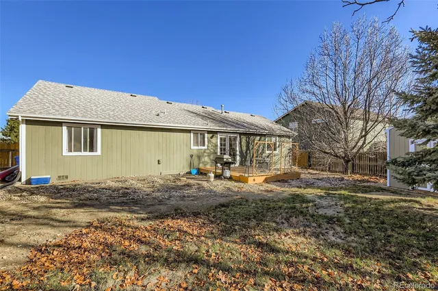 a front view of a house with yard patio and fire pit