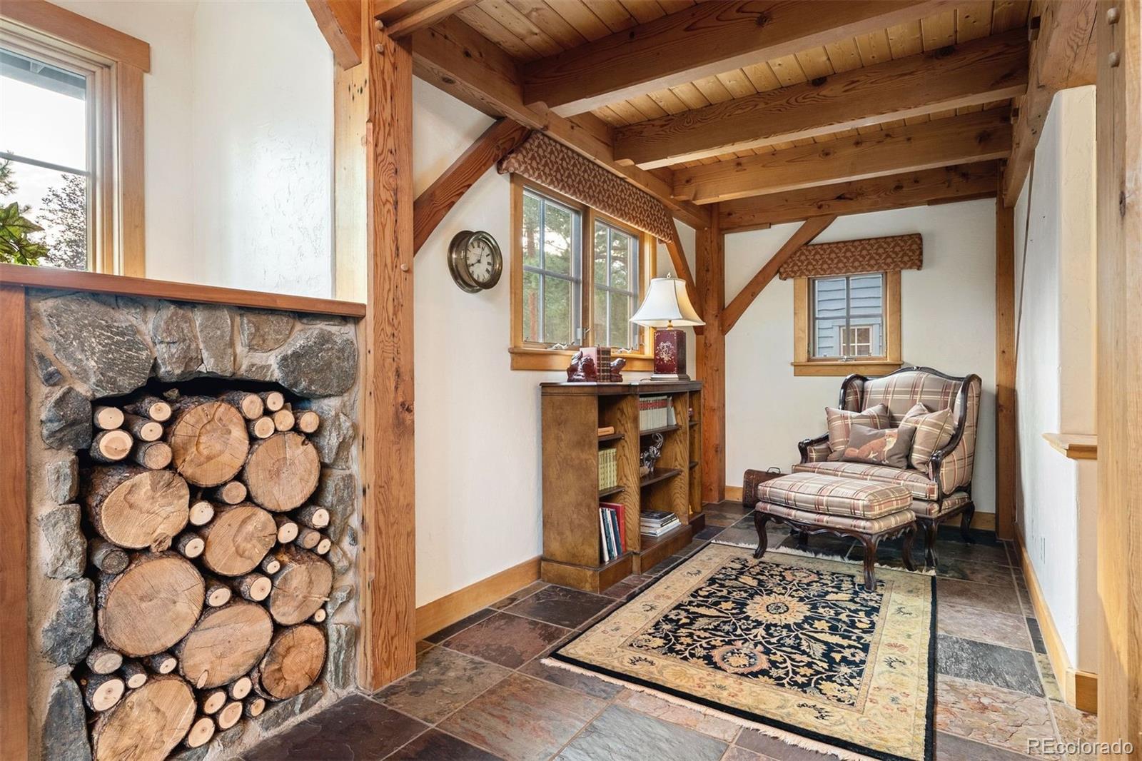 80 Elk Crossing Lane Evergreen, CO 80439 - Photo 11 of 49 a living room with furniture and a rug