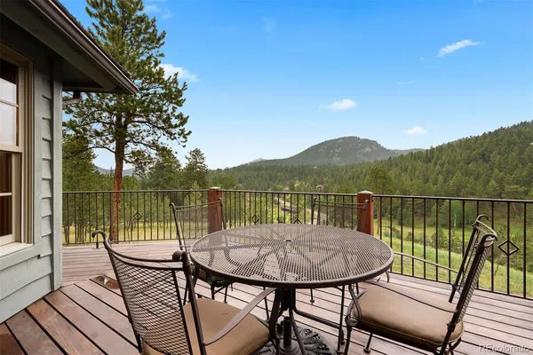 a view of a deck with mountain view and lake view
