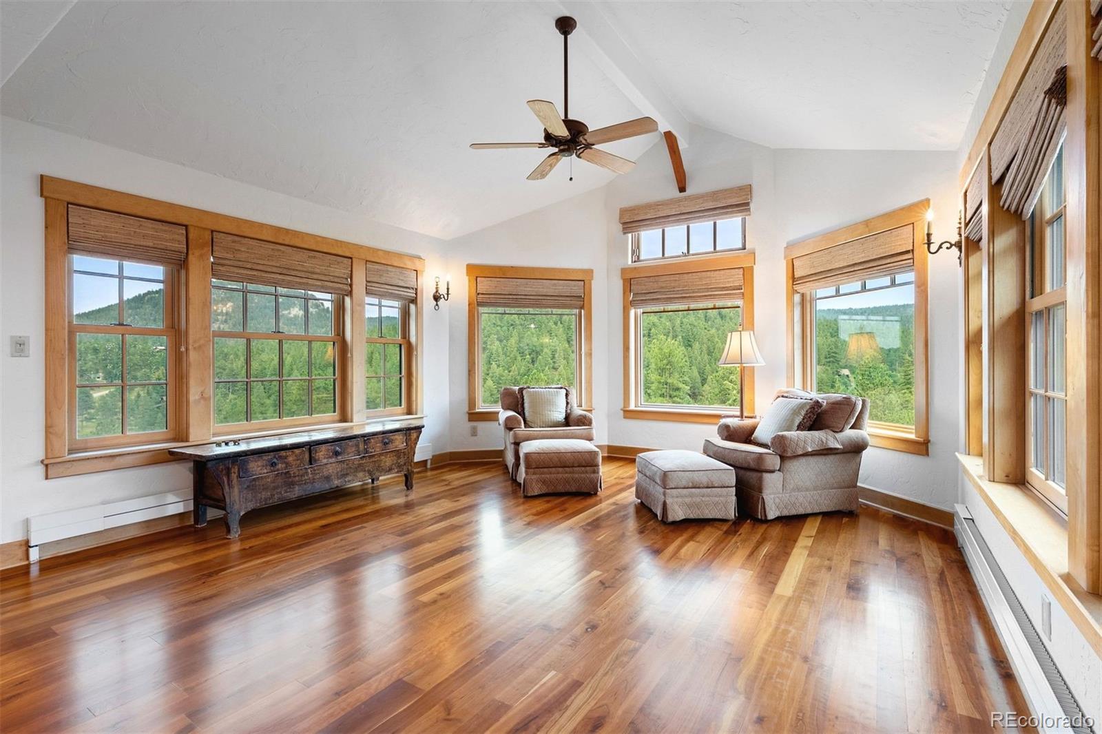 80 Elk Crossing Lane Evergreen, CO 80439 - Photo 25 of 49 a living room with furniture and large windows