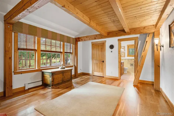 a spacious bedroom with a large window
