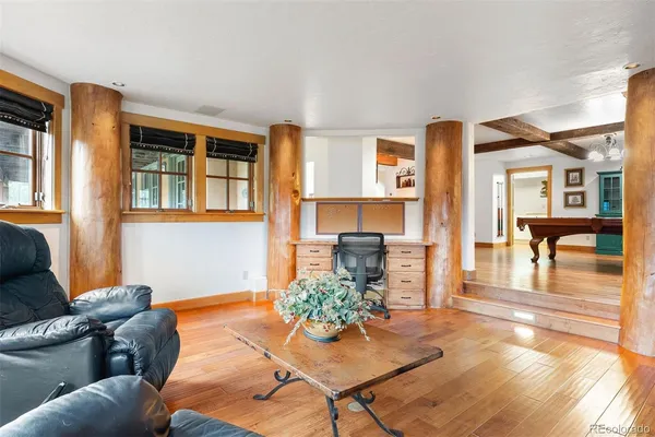 a living room with furniture and a table