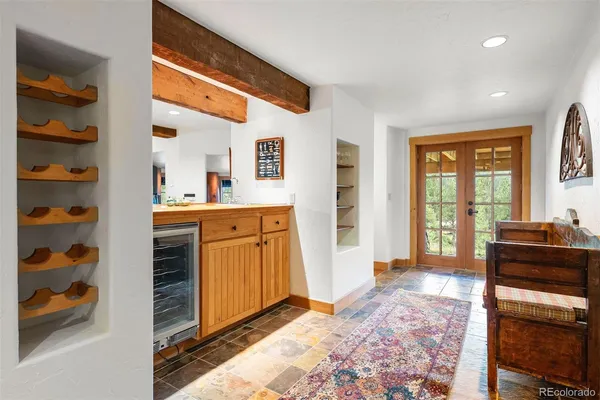 a bedroom with furniture and a window