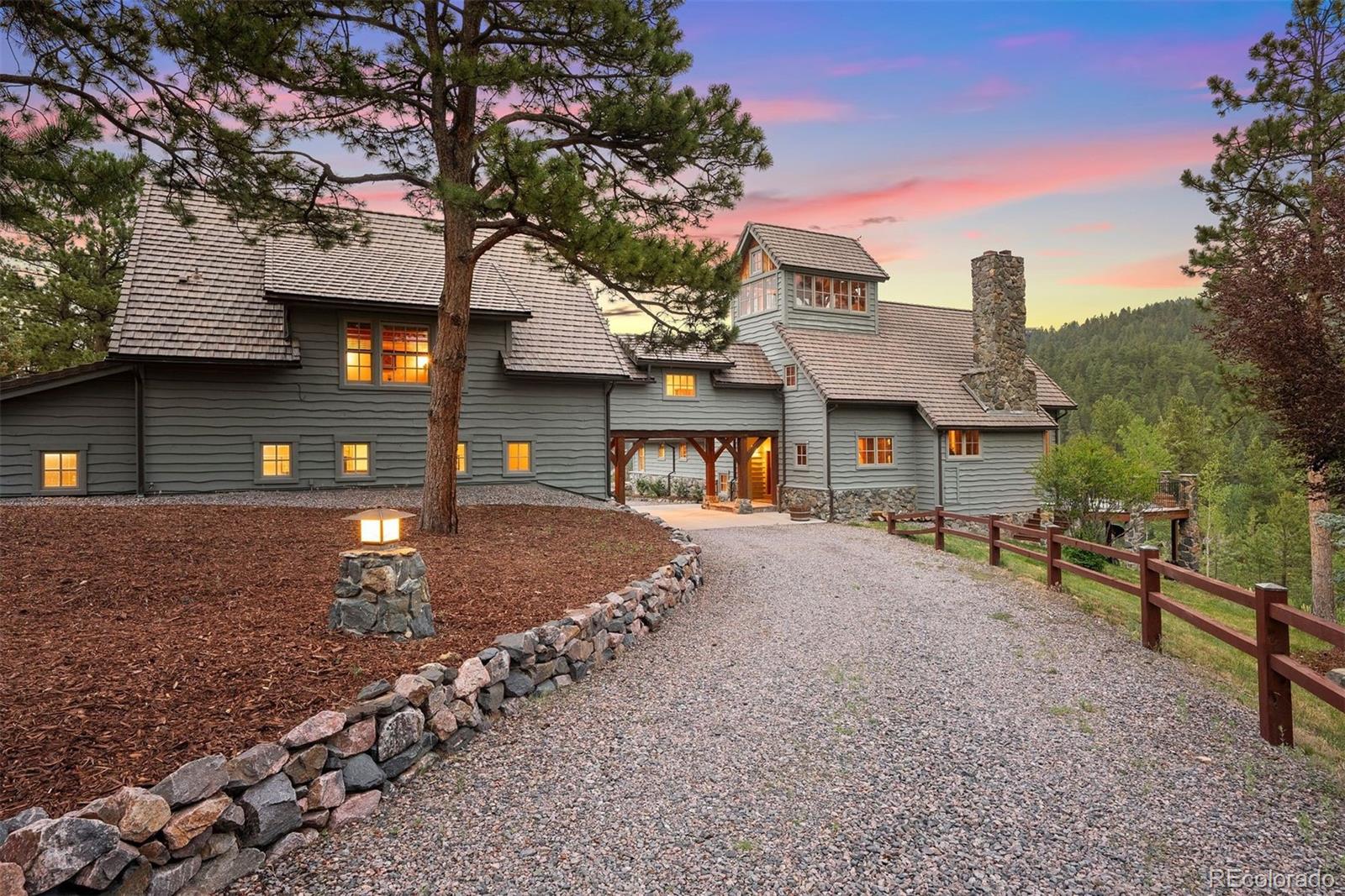 80 Elk Crossing Lane Evergreen, CO 80439 - Photo 45 of 49 a front view of a house with a yard