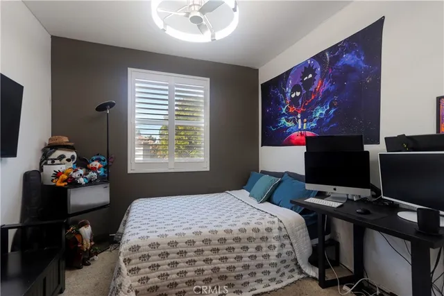a bathroom with a granite countertop sink toilet a mirror and shower
