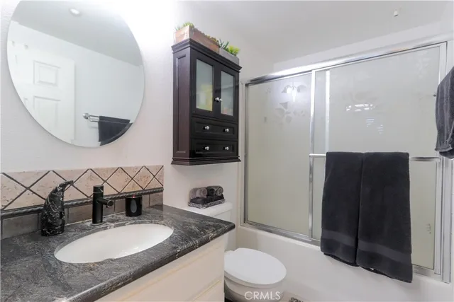 a view of a room with lots of wooden furniture